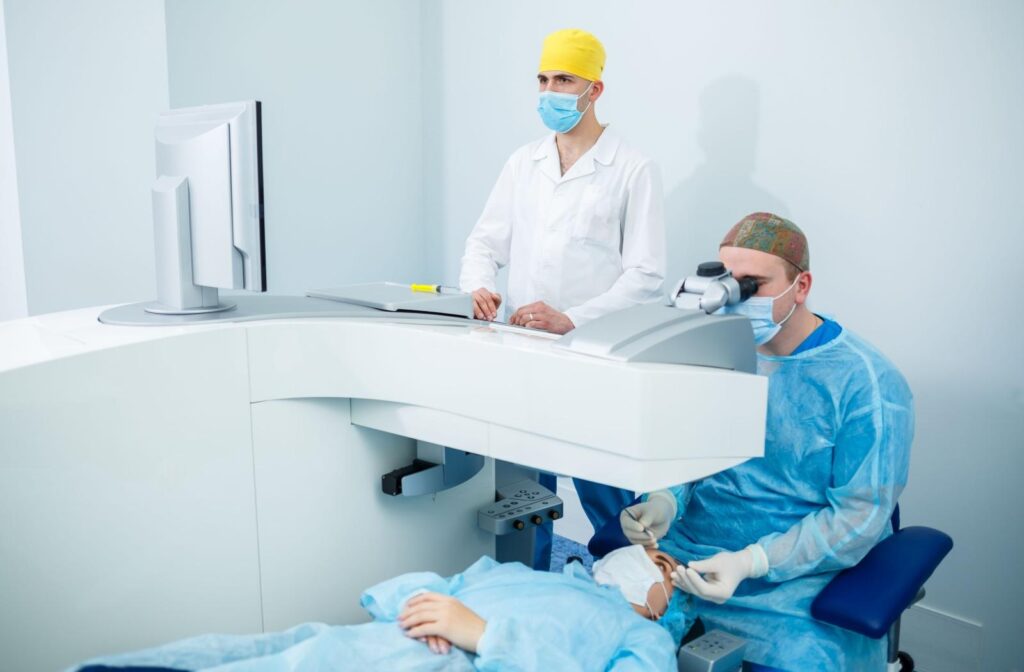 An ophthalmologist performing laser eye surgery on a patient.